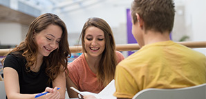 Three students studying on the University campus. 