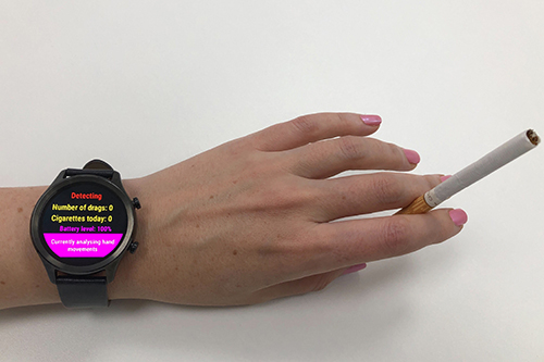 A person wearing the smartwatch on their wrist